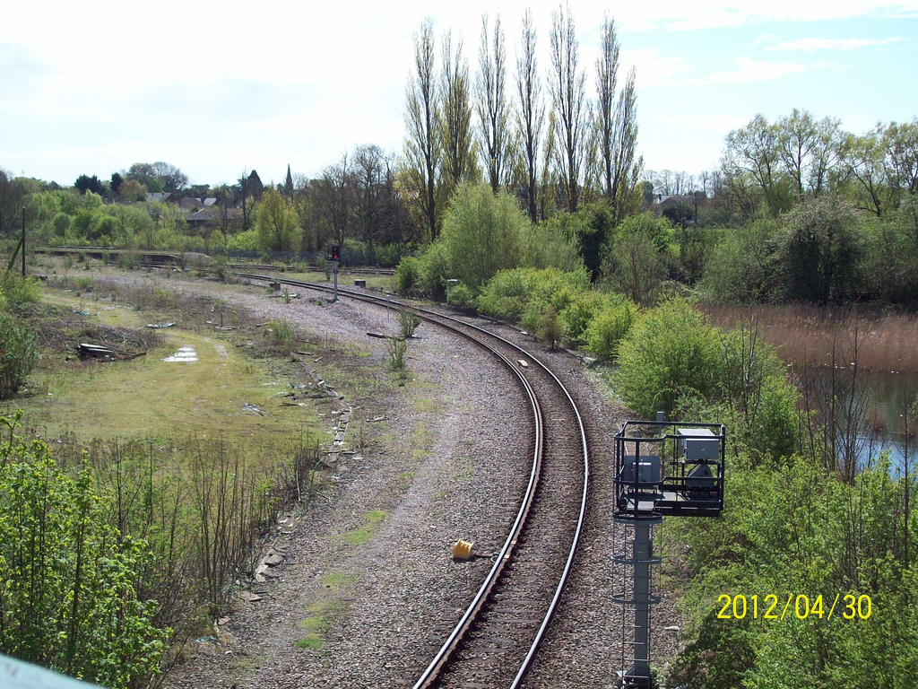 March station left centre with Peterborough to Ely line running from right to left. Line from Wisbech and Whitemoor Yard in foreground.